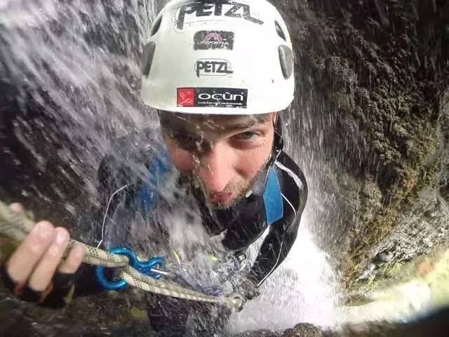 Canyoning in a waterfall